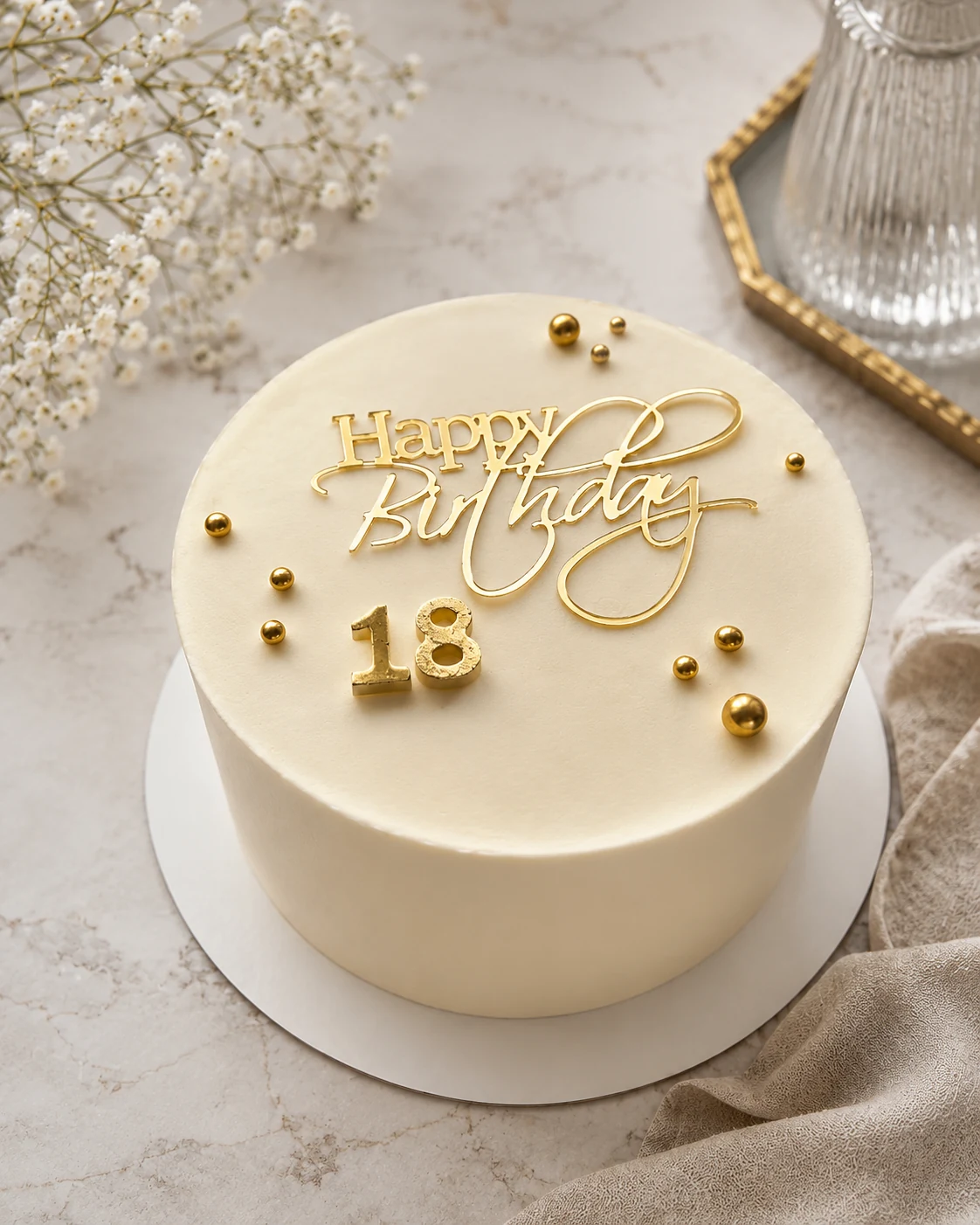 Cream Bento Cake decorated with a gold Happy Birthday topper and number 18
