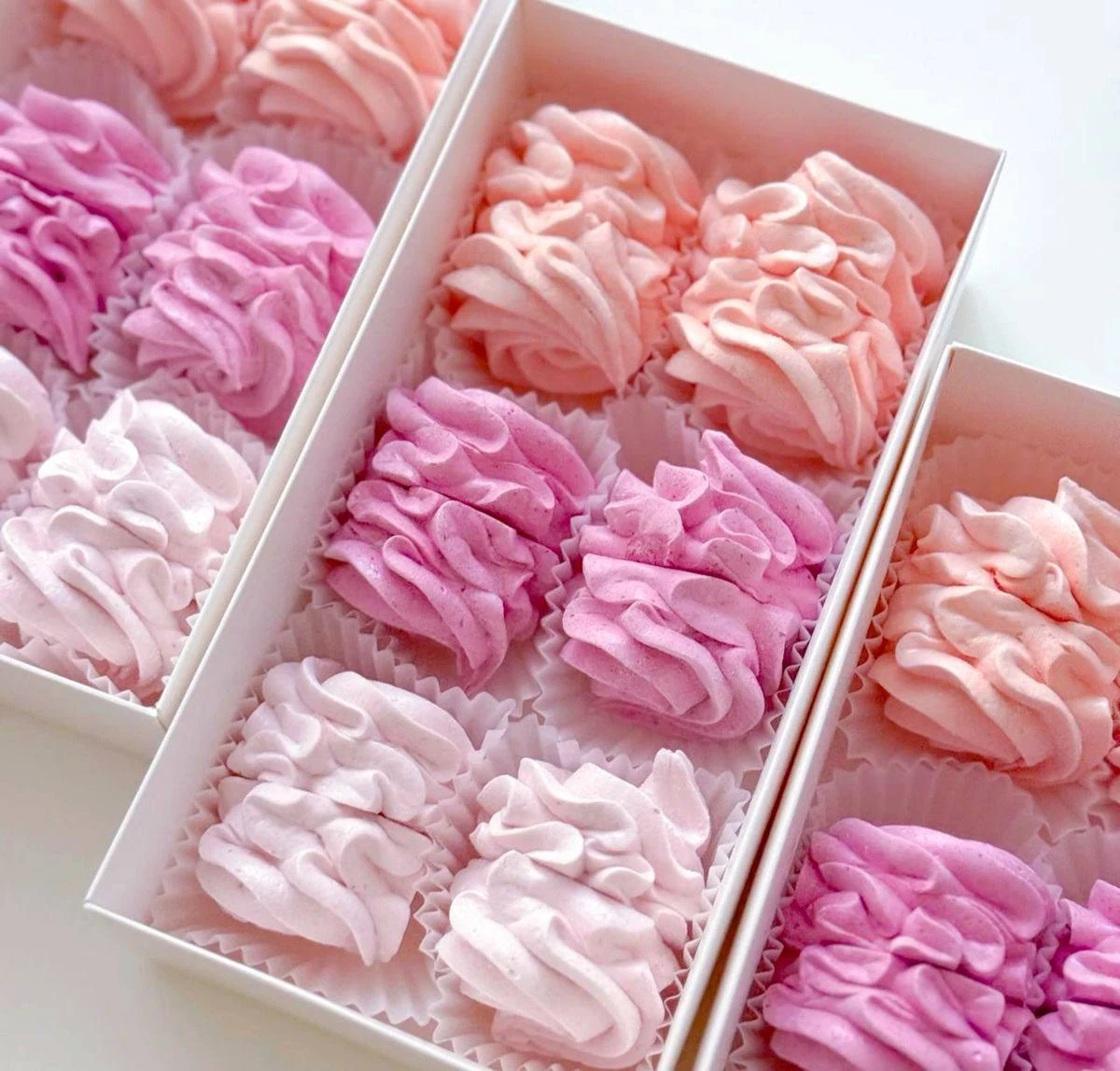 Pink handmade zefir arranged in gift boxes